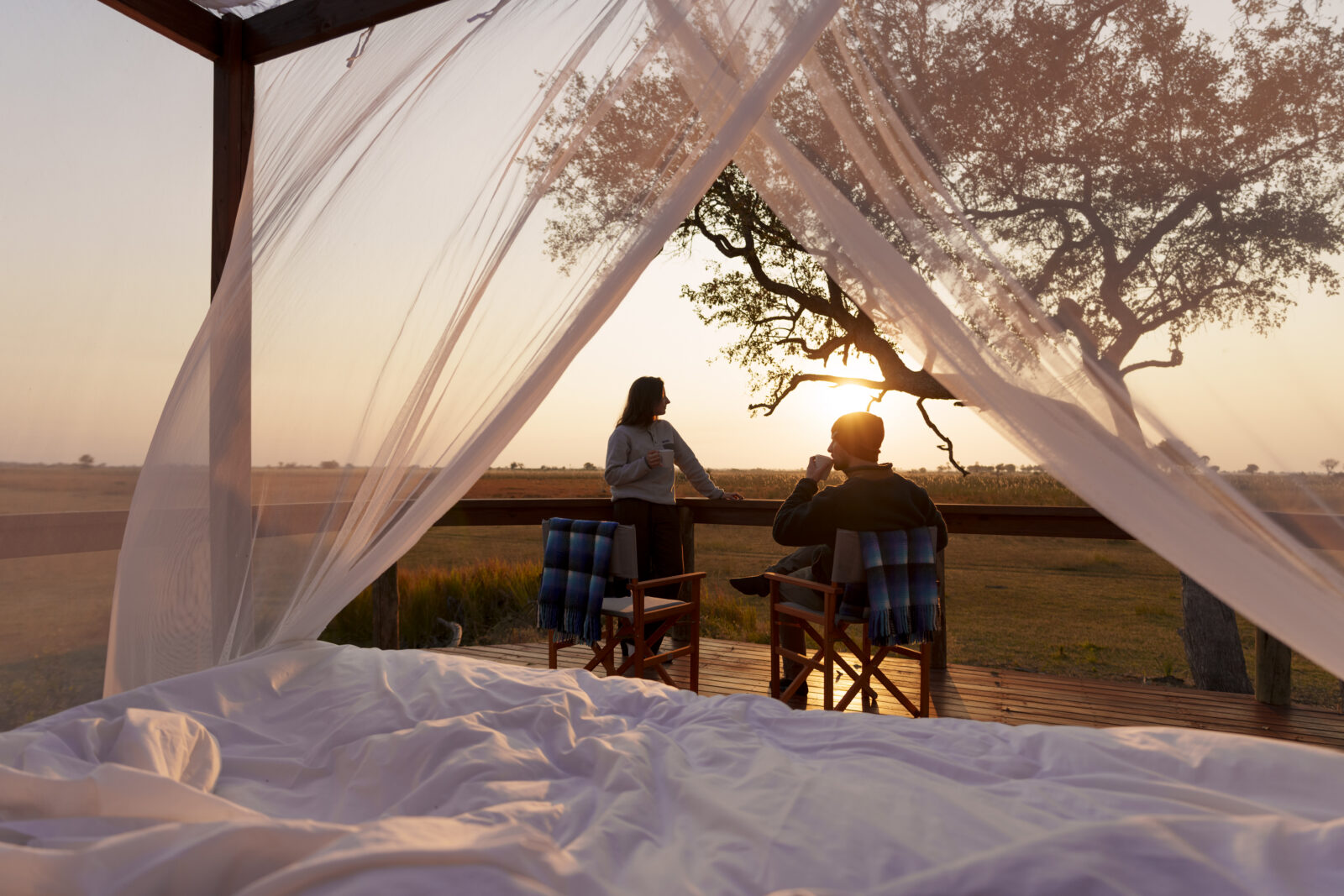 Camp Okavango Sleep-Out Deck overlooking the Okavango Delta at sunrise ny Desert & Delta Safaris.